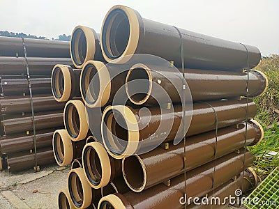 Vitrified clay pipe stacked at the construction site. Stock Photo