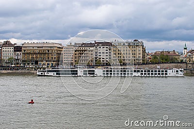 serene beauty a captivating view of the danube river, tourist ship, and budapest's splendor Editorial Stock Photo