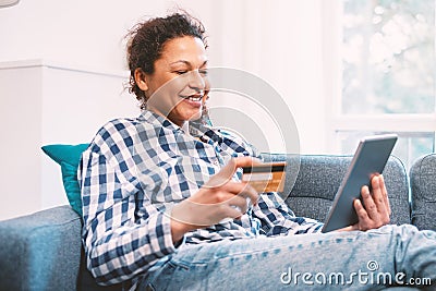 Serene black woman shopping online and electronic banking Stock Photo