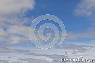 Blue sky canvas with wisps and patches of clouds, ideal for creative sky replacement Stock Photo