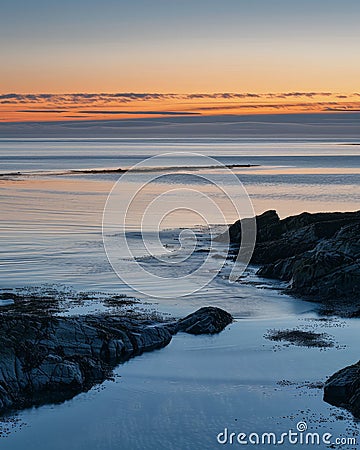 Serene coastal landscape at sunset Stock Photo