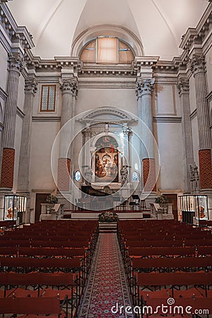 Serene and Elegant Interior of a Venetian Church in Italy with Red Chairs and Large Painting Editorial Stock Photo
