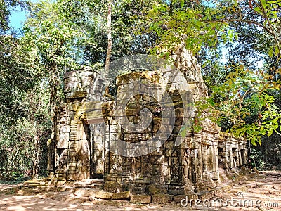 The serene landscape of the Cambodian forest dotted with the remnants of ancient medieval ruins Stock Photo