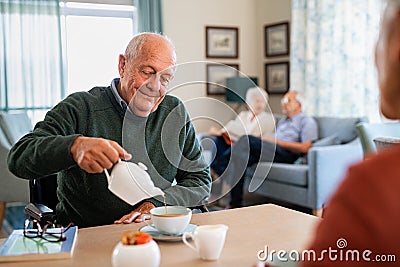 Serene senior man enjoy tea time at nursing home Stock Photo