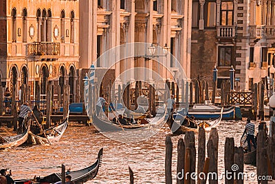 Serene Sunset Scene of Gondolas Gliding Along Grand Canal in Venice, Italy Editorial Stock Photo