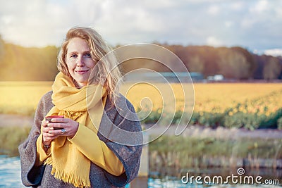 Serene woman in the countryside Stock Photo