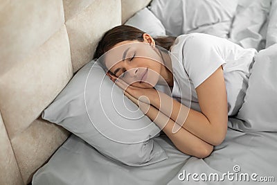 Peaceful european woman enjoying restful sleep Stock Photo