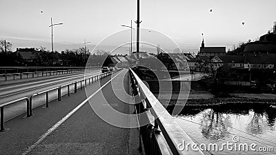 Serenity at dusk on an empty riverside bridge Stock Photo