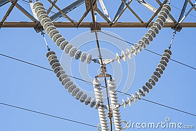 Electrical insulators in on a phylon electrical power line Stock Photo