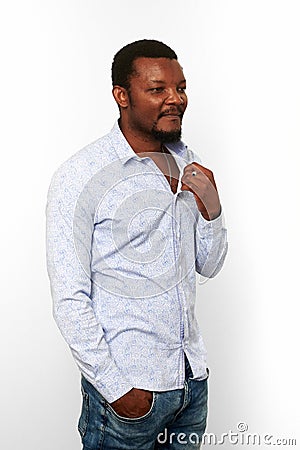 Serious african american black man in casual bright shirt with small beard, isolated background Stock Photo