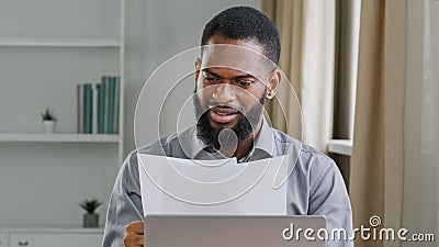 Serious African American man ethnic bearded businessman boss entrepreneur bookkeeper executive in office holding papers Stock Photo