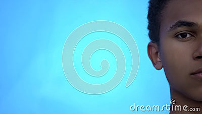 Serious african american teenager looking into camera, racism problems, bullying Stock Photo