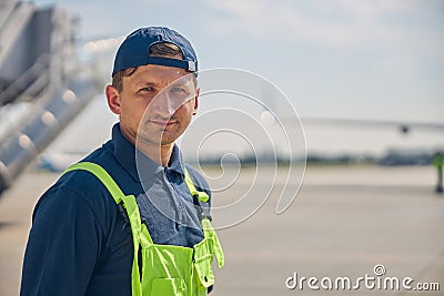 Serious aircraft mechanic posing for the camera Stock Photo