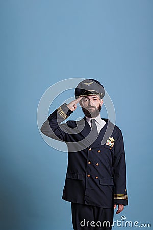 Serious aviation academy airplane aviator saluting Stock Photo