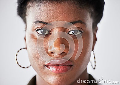 Serious, beauty and face of black woman with confidence on a white background in studio closeup. Student, portrait and Stock Photo