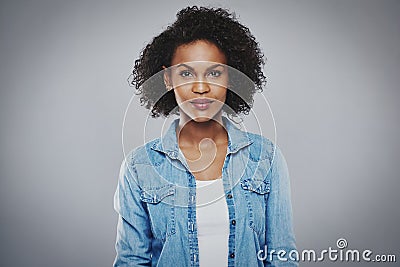 Serious black woman with blue jean shirt Stock Photo