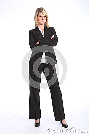 Serious blonde woman in business suit arms folded Stock Photo