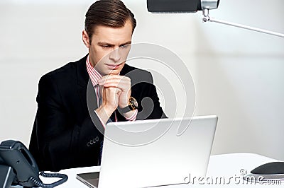 Serious businessman concentrating Stock Photo