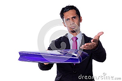 Serious businessman handing a folder with an expression of complaint and anger. Young adult businessman asking to work Stock Photo