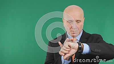 Serious Businessman Image Looking to Wristwatch Stock Photo