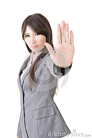 Serious businesswoman making stop sign Stock Photo