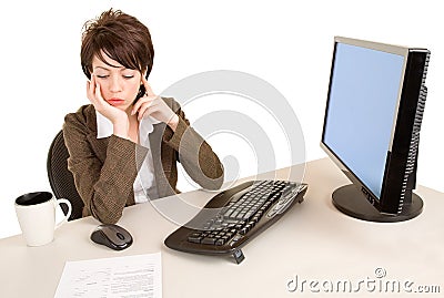 Serious Businesswoman Working at her Desk Stock Photo