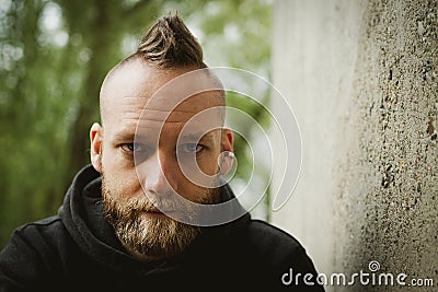 Young man sitting in front of the camera Stock Photo