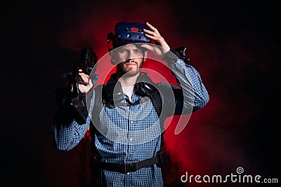 Portrait of young bearded man with virtual shooter Stock Photo