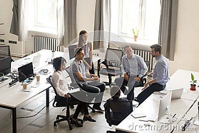 Serious ceo speaking at corporate group meeting, mentoring, top Stock Photo