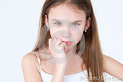 Serious child thinking hand under chin little girl Stock Photo