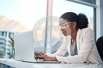 Serious, confident or ambitious business woman thinking, planning and brainstorming idea. Creating entrepreneur typing Stock Photo