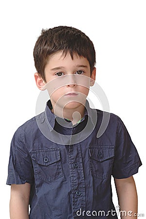 Serious cute little old boy stands isolated Stock Photo