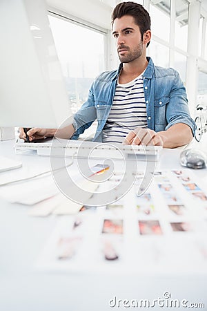 Serious designer using digitizer and computer Stock Photo