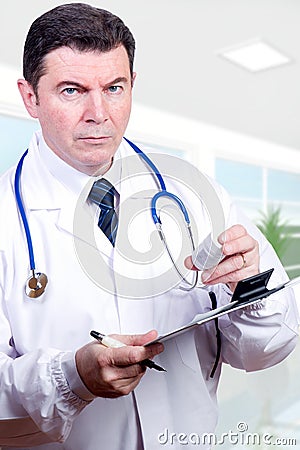 Serious doctor with pills Stock Photo