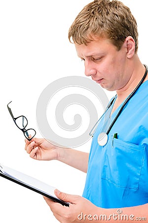 Serious doctor reads the entries in the directory Stock Photo