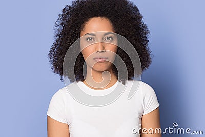 Serious focused african american millennial girl head shot studio portrait. Stock Photo