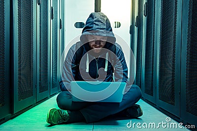 Serious intelligent man sitting on the floor Stock Photo