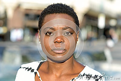 Serious intent young woman staring at the camera Stock Photo