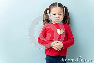 Little girl with a stomachache Stock Photo