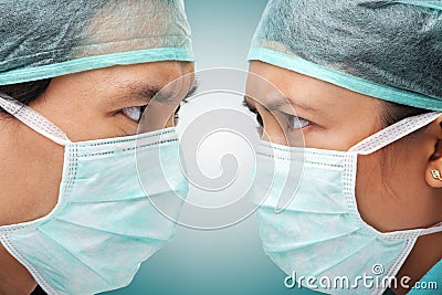 Serious looking between two medical worker Stock Photo