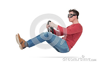 Serious man in goggles drives a car with steering wheel, isolated on white background Stock Photo