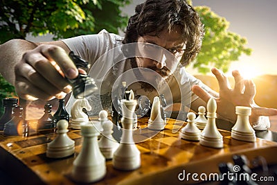 Serious man playing chess Stock Photo