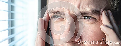 Serious man with stress. Ashamed or depressed person. Burnout, amnesia, memory loss or ptsd concept. Migraine or headache. Stock Photo