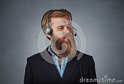 Serious man working as a customer service Stock Photo
