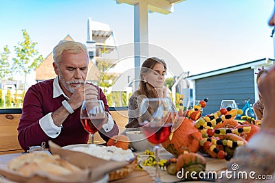 Serious mature man sitting with closed eyes Stock Photo