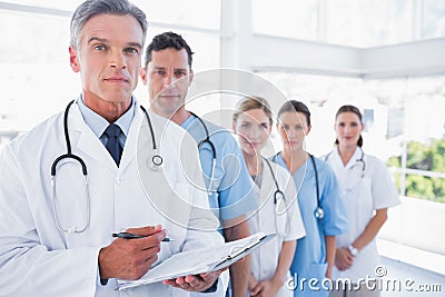 Serious medical team in row Stock Photo