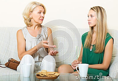 Serious mother and daughter talking Stock Photo