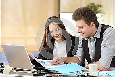 Serious office workers checking statistics Stock Photo