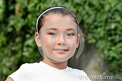 A Serious Philippina Female Child Outdoors Stock Photo