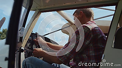 Airplane pilot checking control panel steering wheel before flight close up. Stock Photo